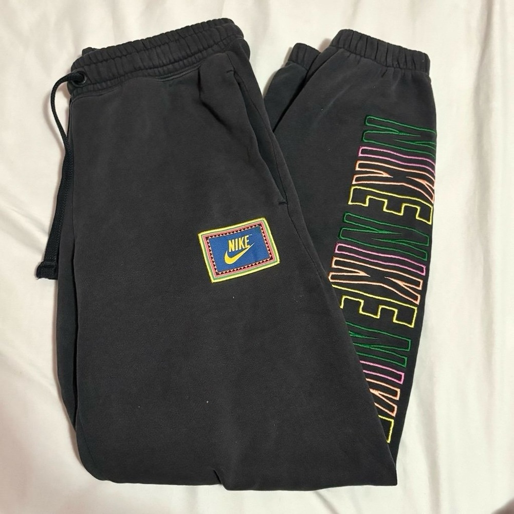 Women’s Nike track pants with colorful embroidery